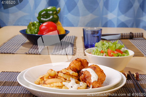 Image of French fries and chicken