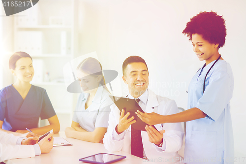 Image of group of happy doctors meeting at hospital office