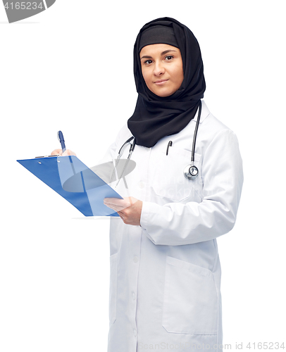 Image of muslim female doctor in hijab with clipboard