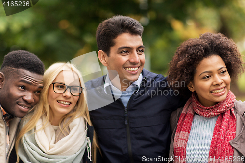 Image of group of happy international friends outdoors