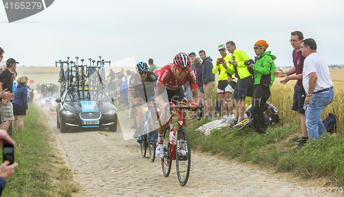 Image of Two Cyclists on a Cobblestone Road - Tour de France 2015