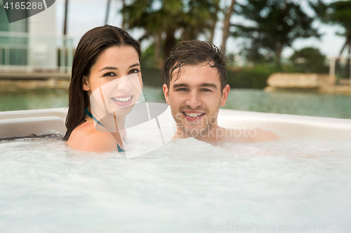 Image of Young couple in a jacuzzi