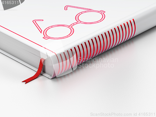 Image of Science concept: closed book, Glasses on white background