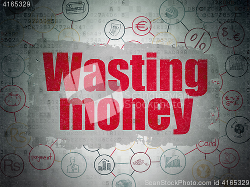 Image of Currency concept: Wasting Money on Digital Data Paper background