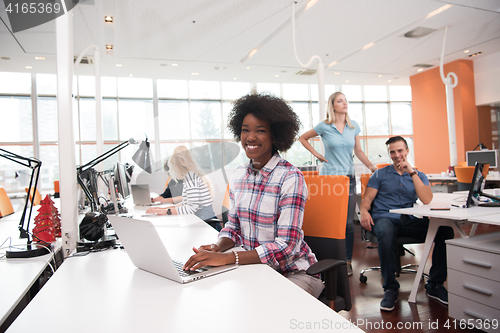 Image of African American informal business woman working in the office