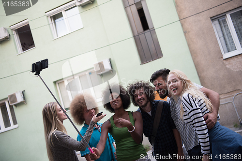 Image of Group of friends taking picture of themselves