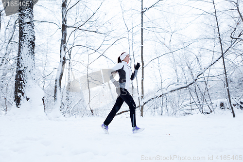 Image of Young brunette on morning jog