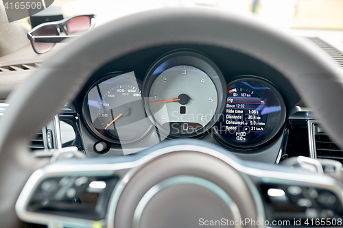 Image of close up of car dashboard and steering wheel