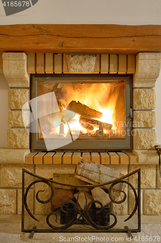 Image of Roaring flames in  fireplace