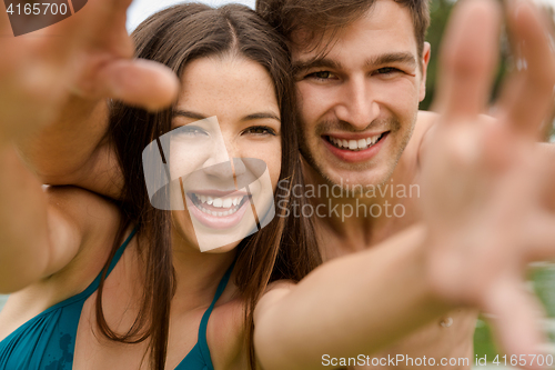 Image of Young couple having fun