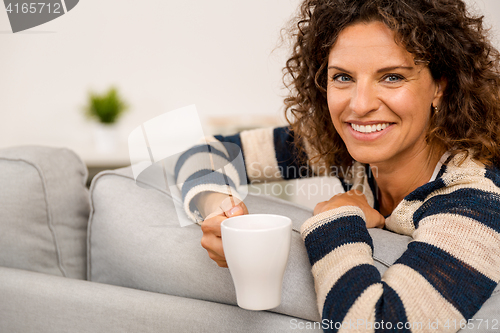 Image of Beautiful woman at home