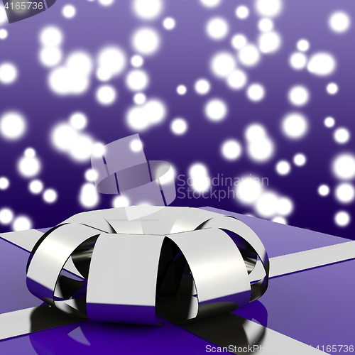 Image of Blue Giftbox With Silver Ribbon And Sparkling Background