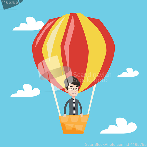 Image of Man flying in hot air balloon vector illustration.