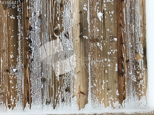 Image of old wood covered with snow background