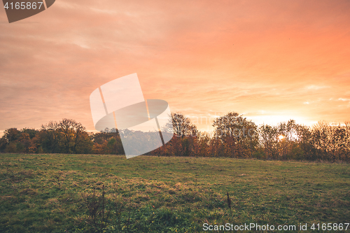 Image of Countryside sunset with orange colors in the sky