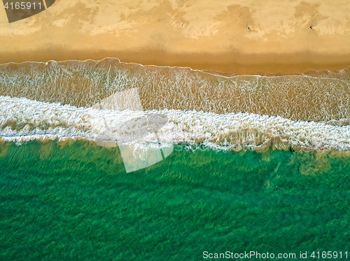 Image of Aerial View Amazing Seascape with Small Waves on Sandy Beach