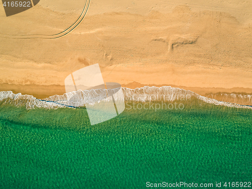 Image of Aerial View Amazing Seascape with Small Waves on Sandy Beach
