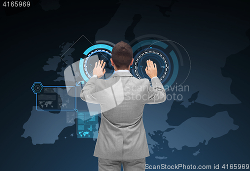 Image of businessman using virtual screen with europe map