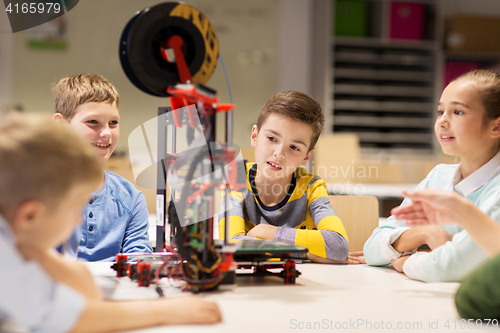 Image of happy children with 3d printer at robotics school