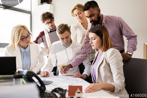 Image of business team discussing house project at office