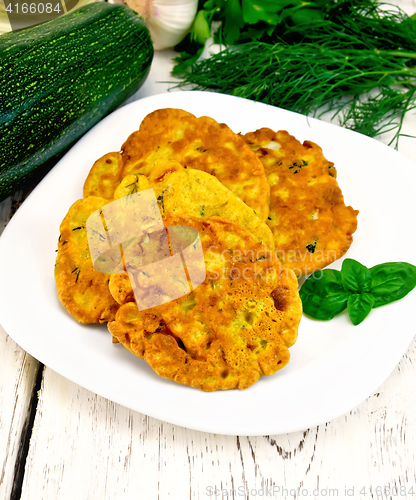 Image of Flapjack chickpeas with zucchini in plate on light board