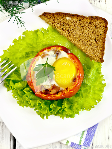 Image of Scrambled eggs in tomato on board top