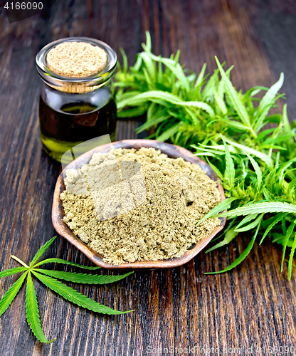 Image of Flour hemp in bowl with oil and leaf on board