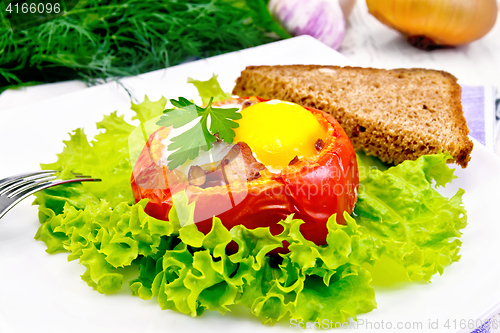 Image of Scrambled eggs in tomato and bread on light board