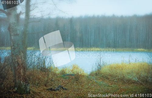 Image of Autumn Landscape With A Frozen River