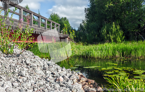 Image of Wooden Bridge Over The River