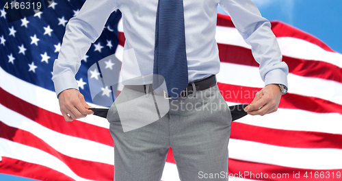 Image of american businessman with empty pockets