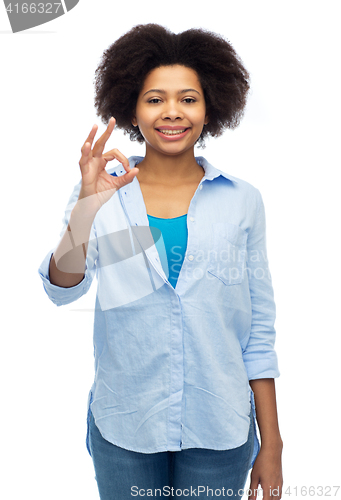 Image of happy african american woman showing ok hand sign