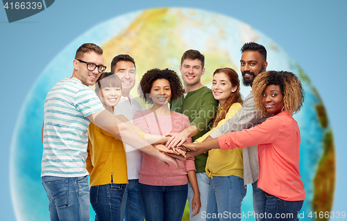 Image of international group of happy people holding hands