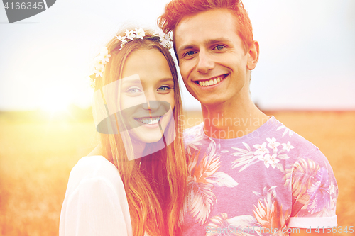 Image of happy smiling young hippie couple outdoors