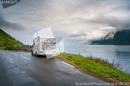 Image of Caravan car travels on the highway.