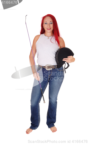 Image of A horseback rider woman with helmet.