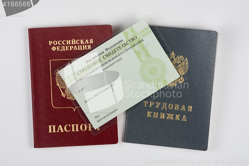 Image of Passport, employment history, and a certificate of insurance on a white background