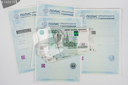 Image of Russian money is on the policy of compulsory medical insurance, white background