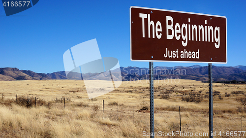 Image of The Beginning brown road sign