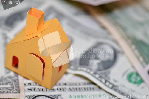 Image of Paper house model and money