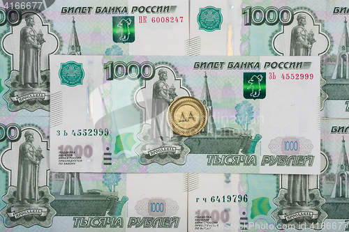 Image of On thousandth bill Russian rubles coin is \"YES\", the inscription