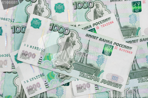 Image of Background of scattered banknotes - Russian ruble denomination one thousand rubles