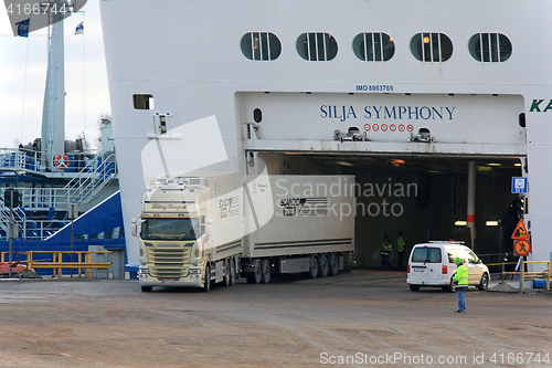 Image of Cargo Truck Exits Ferry at Sea Port