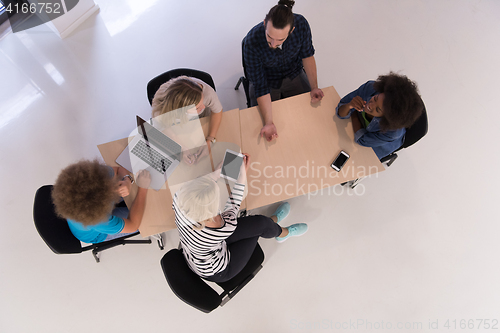 Image of Multiethnic startup business team on meeting  top view