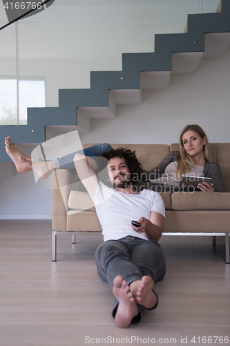 Image of young couple relaxes in the living room