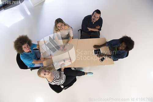 Image of Multiethnic startup business team on meeting  top view