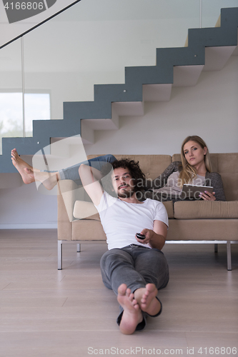 Image of young couple relaxes in the living room