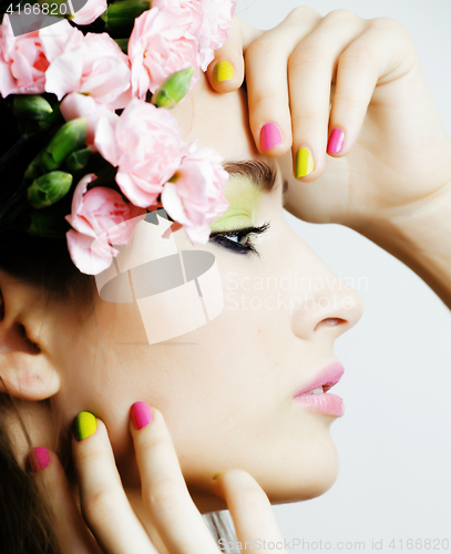 Image of Beauty young woman with flowers and make up close up