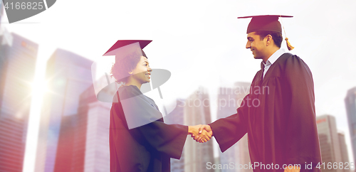 Image of happy students or bachelors greeting each other