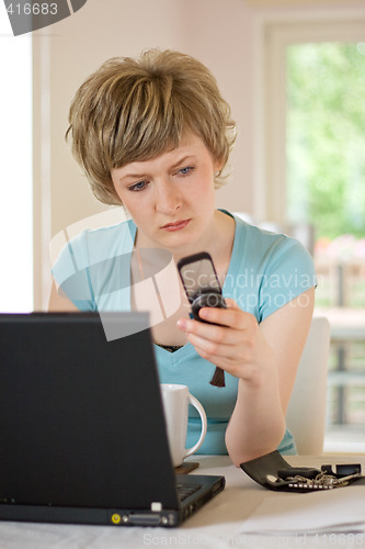 Image of young woman working on a laptop